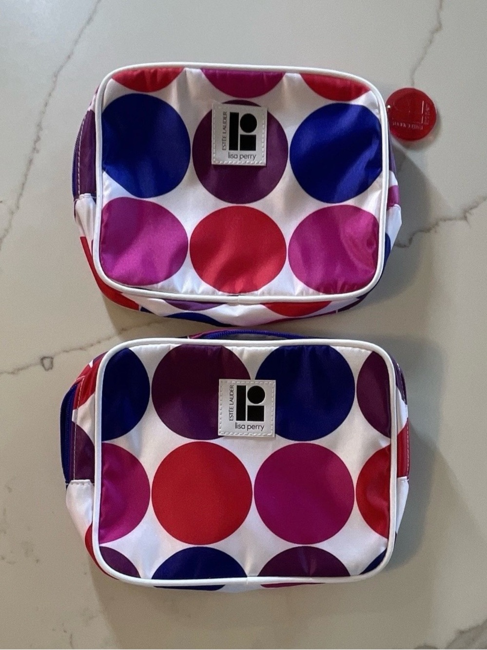 Estée Lauder Lisa Perry Polka Dot Cosmetic Bags Red, Pink, Purple, Blue set of 4
